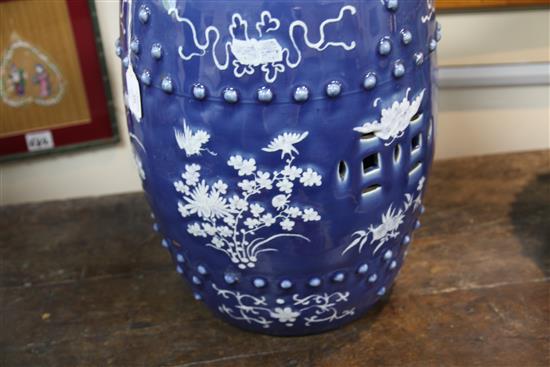 A Chinese blue ground white slip decorated barrel shaped garden seat, late 19th century, 46.5cm